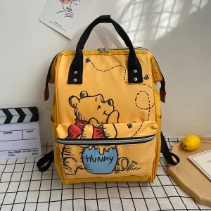 Disney Winnie l&rsquo;Ourson sac à dos enfant style cartoon matériaux synthétiques idéal pour l&rsquo;école ou les loisirs