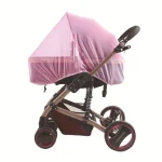 Poussette bébé moderne avec capote rose translucide châssis doré suspensions arrières rangement intégré design élégant usage quotidien confort et sécurité