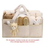Sac à couches bébé rangement portage pratique sécurité confort minimaliste beige accessoires soins convenance qualité famille
