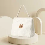 Sac à langer mode maman bébé multifonction style épuré pratique durabilité confort accessoires originaux