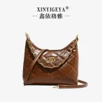 Sac à main vintage maroquinerie élégant design minimaliste cuir couleur marron richesse accessoire mode femme quotidien