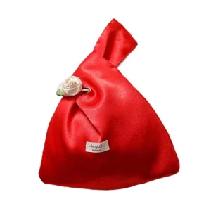 Sac à main élégant en satin rose style moderne design floral accessoire chic pour soirée ou sortie